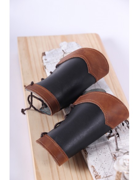 Medieval brown and black leather bracers with rivets